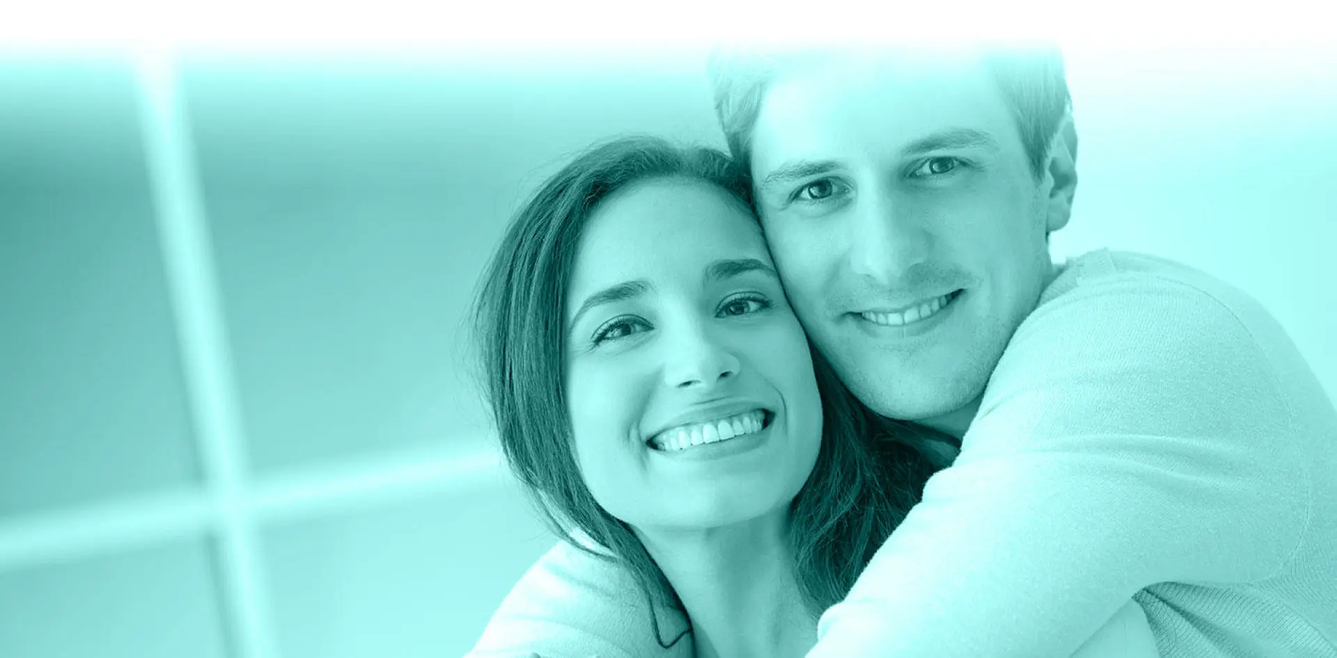 hero 02 Smiling couple embracing with teal tint.