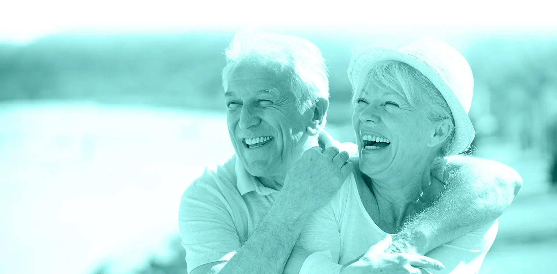 hero 03 Smiling older couple embracing outdoors, monochrome.